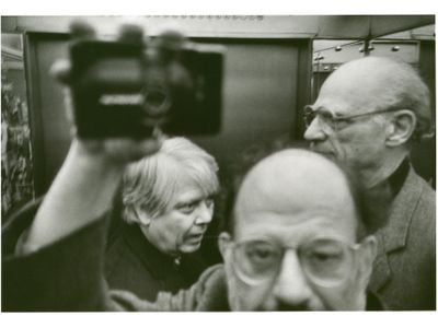 Allen Ginsberg photographs himself, Arthur Miller and William H. Gass in an elevator in Copenhagen&#39;s Hotel Royal.