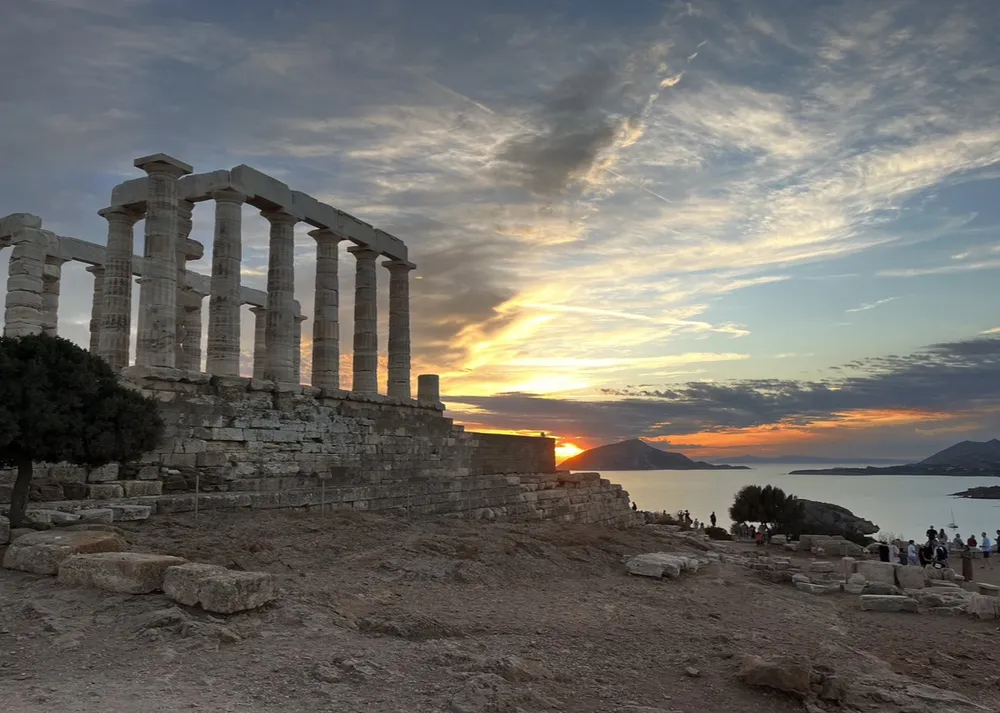 Magnificent Temple of Poseidon in Cape Sounio, Sounio, Greece at sunset. This striking image is mesmerizing in its majestic beauty.