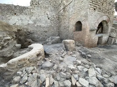 At this ancient bakery, enslaved individuals and donkeys worked under bleak conditions to grind grain.