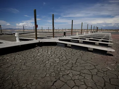 Boat docks sit on dry, cracked earth at the Great Salt Lake&#39;s Antelope Island Marina on August 1, 2021.