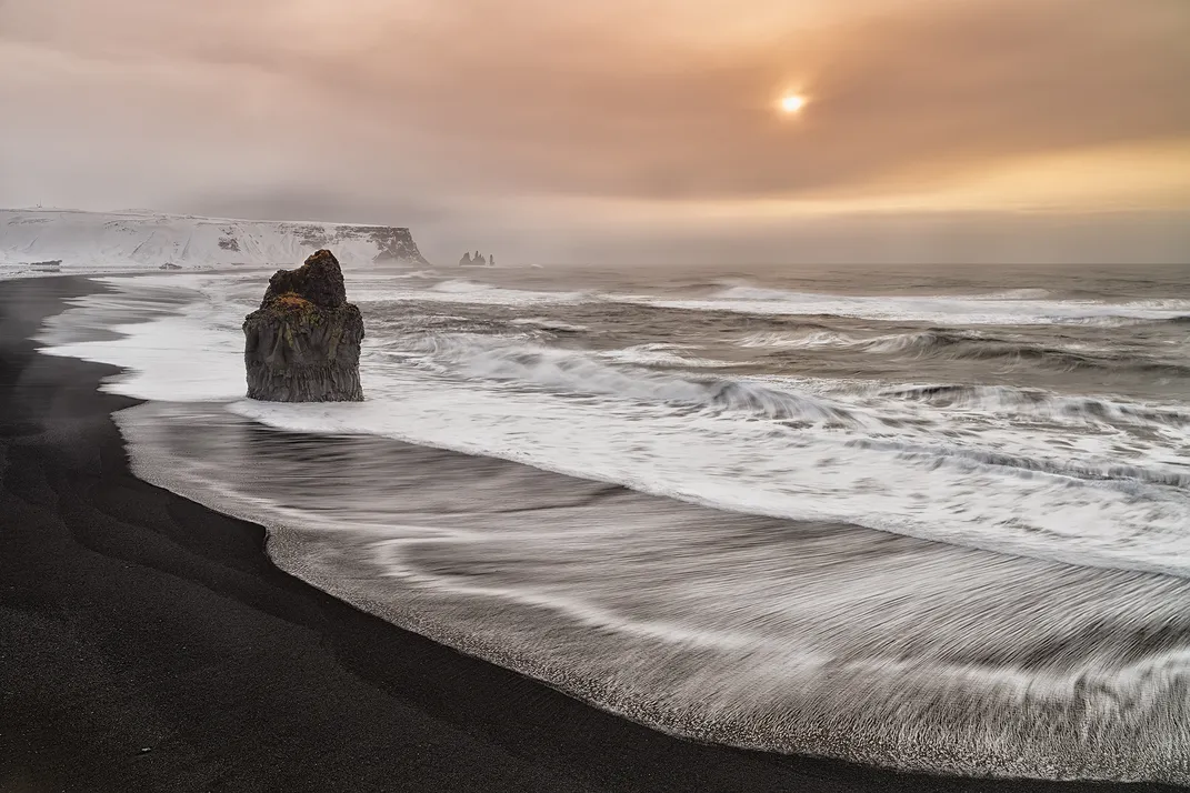 13 - The iconic Reynisfjara Beach is said to have waves 120 feet high. It’s also known for its black sand, basalt columns and arched cliff.