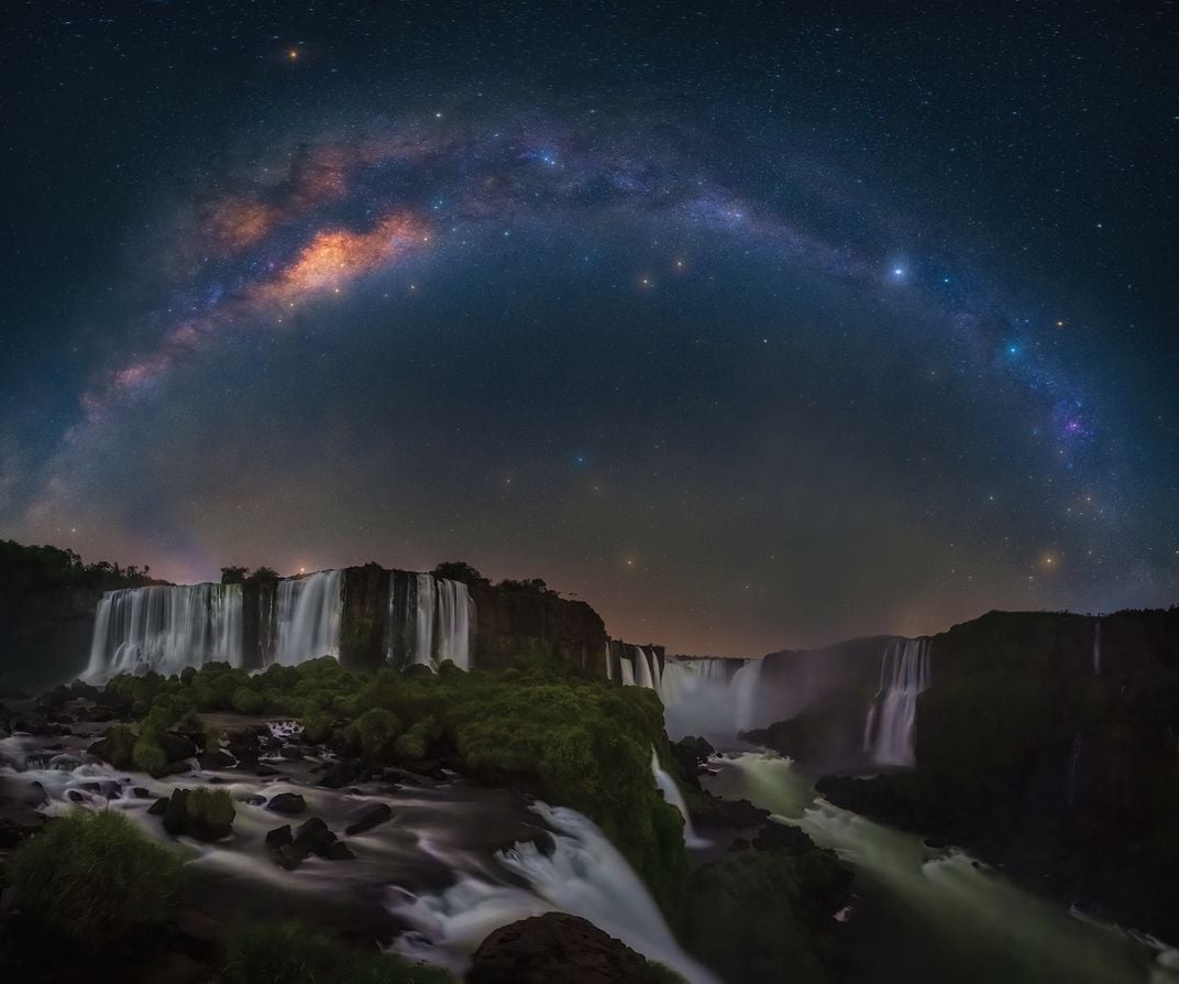the night sky above waterfalls