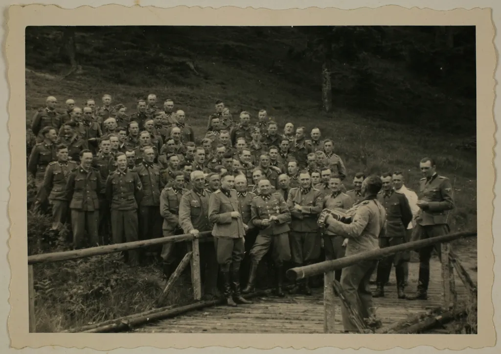 An accordionist leads a singalong for SS officers at their retreat outside of Auschwitz.