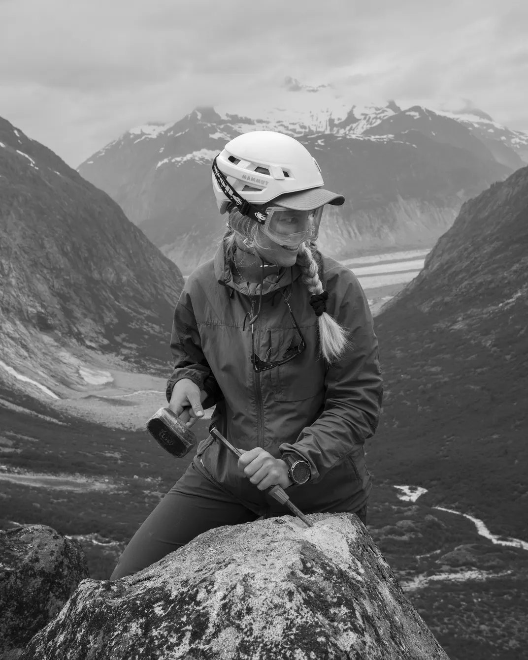 Student Fabienne Meier collects a rock sample above Alaska's Avalanche Canyon.