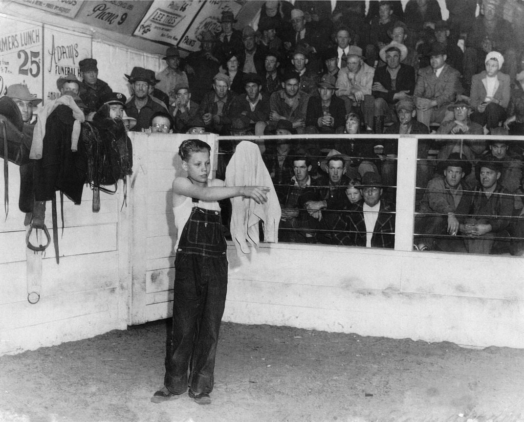 Gene Slattery auctions his shirt, pledging to donate the proceeds to the canteen.