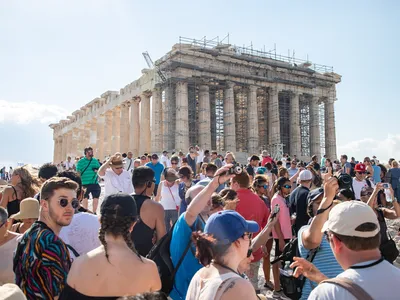 As many as 23,000 tourists visited the Acropolis per day last summer.