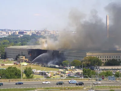 Smoke pours from the west wing of the Pentagon building September 11, 2001 in Arlington, Virginia, after a plane crashed into the building and set off a huge explosion. (Photo by Alex Wong/Getty Images)