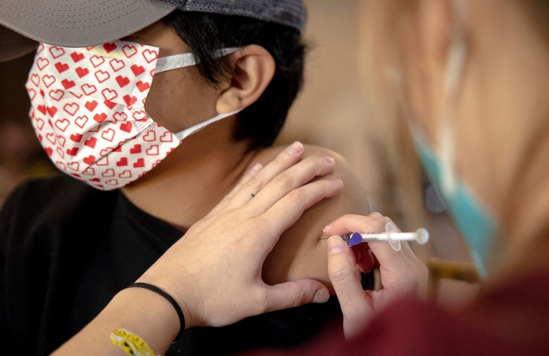 Man receives Covid-19 vaccine