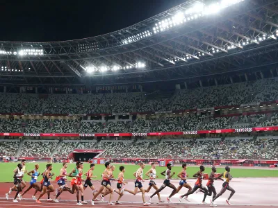 Olympic runners compete during the 10,000 meters race in Tokyo. In ancient times, running was likely used to push animals to exhaustion during hunting.