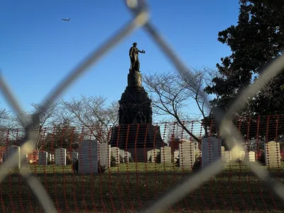 Safety fencing at Arlington National Cemetery rings the Confederate memorial.