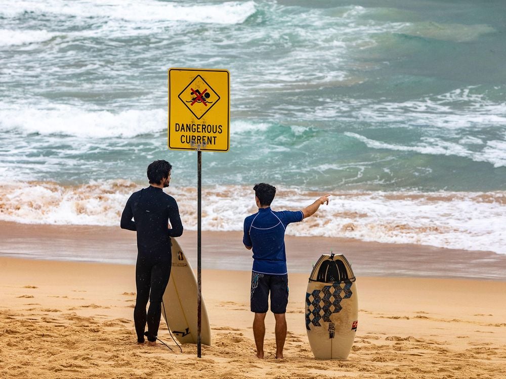 Surfers Standing on Beach