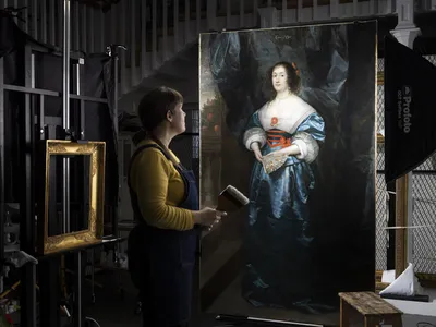 Alice Tate-Harte, a conservator at English Heritage, works on a 17th-century portrait of Diana Cecil.