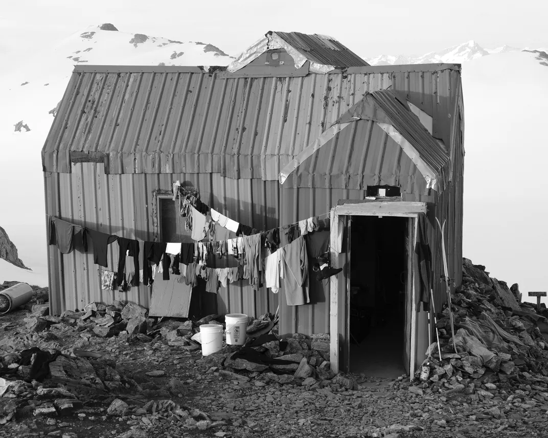 Clothes and gear dry outside at Camp 17. In the absence of running water, participants use melted snow for laundry and bathing.