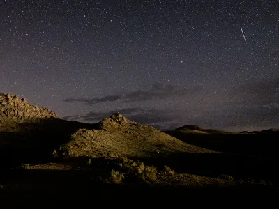 A meteor streaks across the sky near Lone Pine, California, during the annual Perseid meteor shower in 2022.