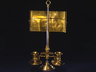 George Washington used the light of this brass candle stand while laboring over his farewell address in 1796.
